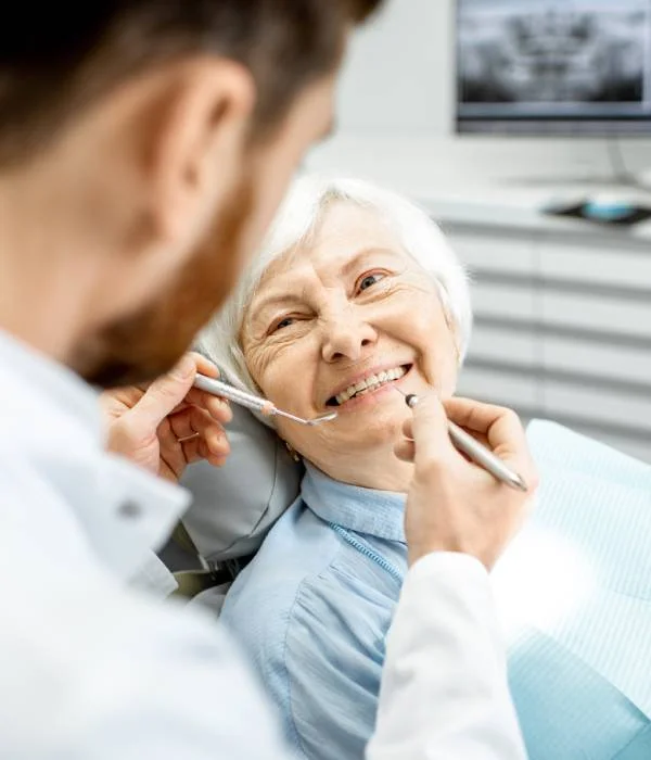 Dentist-with-old-women ADVANCED DENTAL SOLUTIONS img